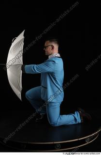 01 2018 01 MIKAEL KNEELING POSE WITH UMBRELLA